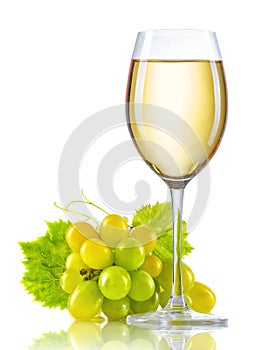 Glass of white wine and a bunch of ripe grapes isolated