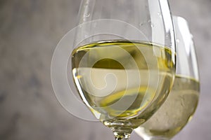 Glass of white wine grapes autumn season aligote vintage on a concrete background