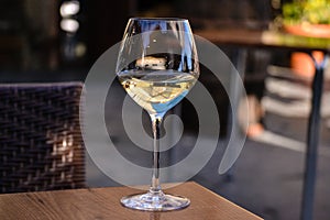 Glass of white wine half full