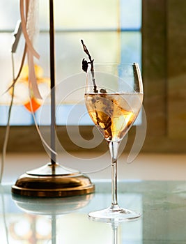 Glass of white wine with ice