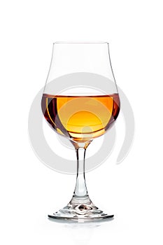 A glass with white wine isolated on white background. Rose wine splashing in glassware.