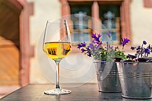 A glass of white wine at a restaurant in Riquewihr, France, Alsatian Wine Route