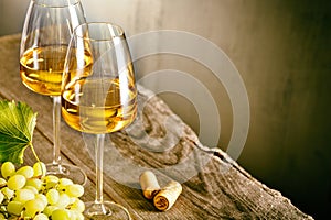 Glass of white wine on vintage wooden table