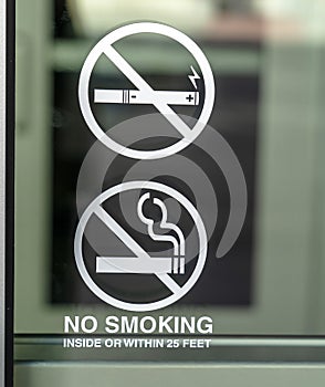 Glass window of a building with No Smoking sign