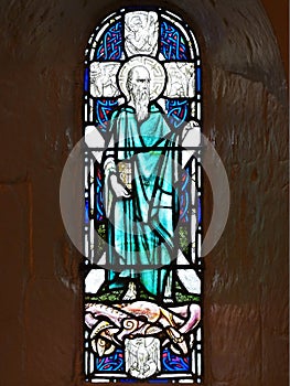 Glass window with Saint Andrew and the Cross