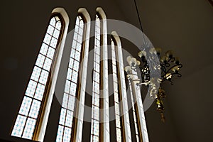 Glass windows and chandelier in small church