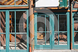 Glass windows and doors with turquoise frames