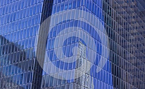 Glass windows skyscraper exterior background surface with reflection modern city center business building urban landmark view