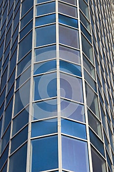 Glass windows of tall building. Close up