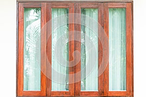 Glass windows with wooden frame on white wall