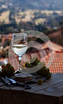 Glass wine on a background of mountains