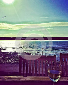 Glass of wine with beautiful seaside views