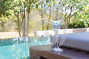 Glass of wine on the bed