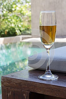 Glass of wine on the bed