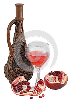 Glass of wine, bottle and a red pomegranate