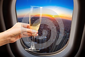 Glass of wine and Chicago view from plane window