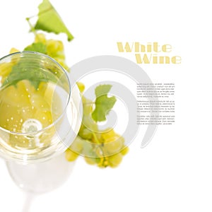 Glass with wine and cluster of grapes isolated on white background with copyspace