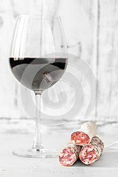 Glass of wine with fuet photo