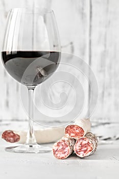 Glass of wine with fuet photo