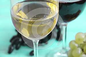 Glass of wine, grapes harvesting selection vintage on a blue background