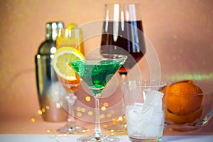 a glass of wine with lights , celebration, alcoholic photo