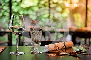 A glass of wine is placed on the dinner table.