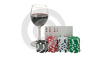 Glass of wine, poker, royal flush and gambling chips