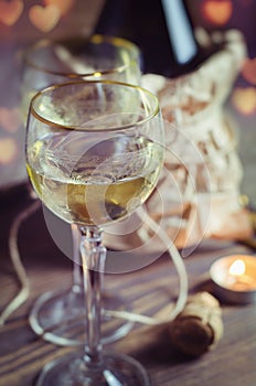Glass with wine on romantic Valentines day background.
