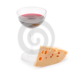Glass of wine and a slice of cheese