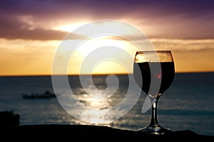 A glass of wine at sunset