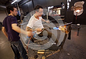 Glass Workers Using Blowtorch photo