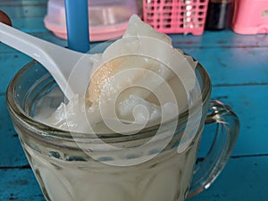 a glass of young coconut ice that refreshes and restores energy