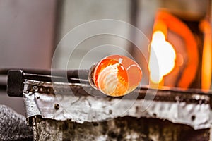 Glassblowing Piece and Furnace in Background