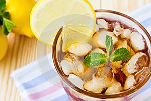 Glasse of ice tea with lemons and mint