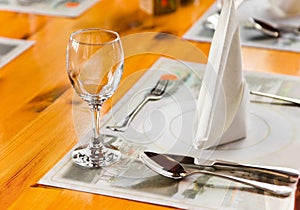Glasse and plate on table in restaurant