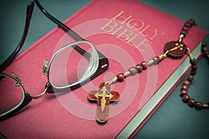 Glasses adjusted on the holy bible