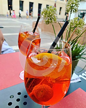 glasses with aperitivo, spritz, drink with aperol, drinks with ice, orange and olive, Italian aperitiv, afternoon relaxation