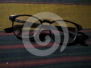 The glasses appear to be made from plastic or metal material, as evidenced by their thin frames and sleek design. photo