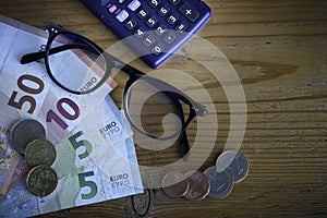 Glasses and banknotes in euros photo