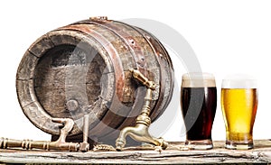 Glasses of  beer and ale barrel on the wooden table. Craft brewery. Clipping paths