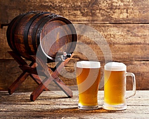 Glasses of beer with barrel