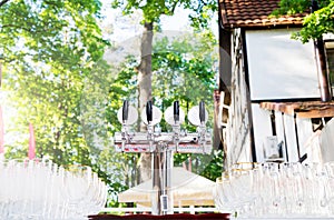 Glasses for beer and a beer faucet on a picnic