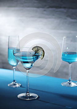 Glasses with blue alcohol cocktail ready for a party