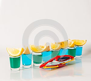 Glasses with blue and green kamikaze, glamorous drinks, mixed dr