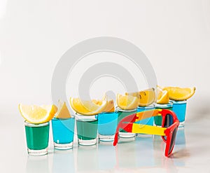 Glasses with blue and green kamikaze, glamorous drinks, mixed dr