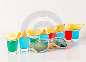 Glasses with blue, green and red kamikaze, glamorous drinks, mix