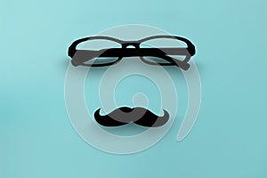 glasses on blue isolated background with Moustaches