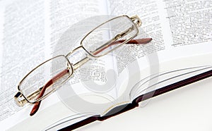 Glasses on the book