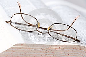 Glasses on the book