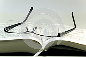 Glasses on a book photo